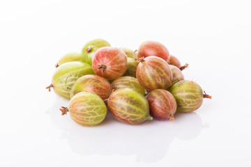 heap of green gooseberries isolated on white background