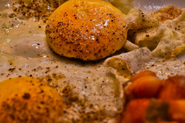 Fried egg with bread and baked white beans in tomato sauce, food