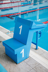 Naklejka premium Starting block, number 1, swimming pool with an empty race track. Sport swimming