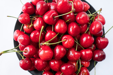Cherries on a white background. Fresh cherries. Cherry fruit. Cherries with copy space for text. Top view. Background of cherries.