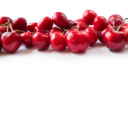 Cherries on a white background. Fresh red cherries. Texture blueberry berries close up. Cherry fruit. Cherries with copy space for text. Top view. Background of cherries.