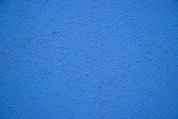 Obraz na płótnie Canvas Blue painted wall concrete stucco surface texture