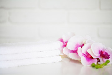 White towels on white table with copy space on bath room background
