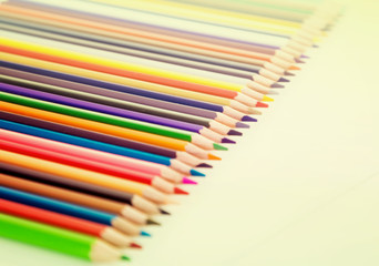 colored pencils lying in row