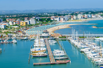 Fototapeta na wymiar Aerial view of Rimini beach and docks in Italy