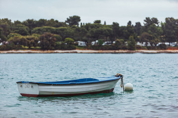 Fototapeta na wymiar old wooden boat in sea bay