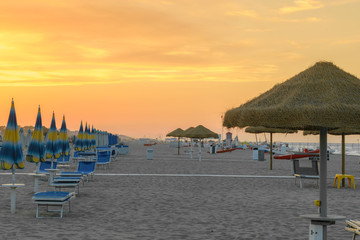 Parasols and sunbeds in Rimini resort beach