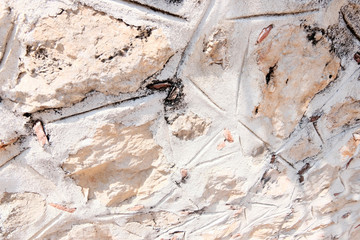 Stone masonry of an ancient fortress. Retro or grunge texture. Abstract image of a stone wall. Light background.