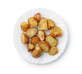Top view of baked potatoes wedges on plate