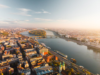 Aerial view of Budapest from above with Dunabe river and Margaret Island during mystical sunrise in...