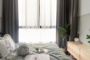 Defocused bedroom and curtain window with sunlight in the early morning. For montage product display or design key visual layout