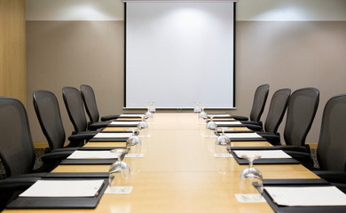 Projection screen in empty conference room