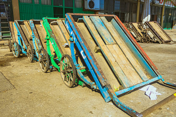 colored wheelbarrows, transport vehicle