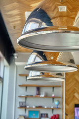 Fototapeta na wymiar Illuminated metal electric lamp. Modern interior