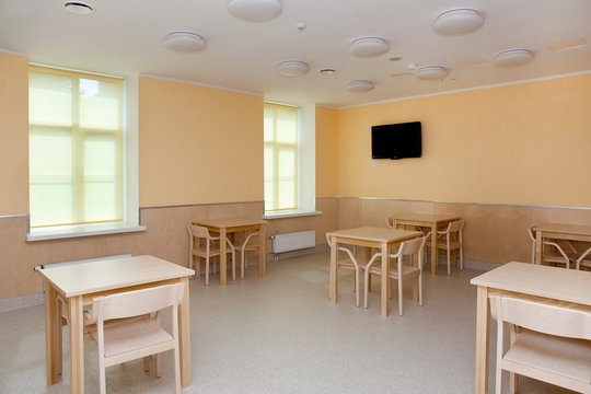 Hospital Room With Tables and Chairs