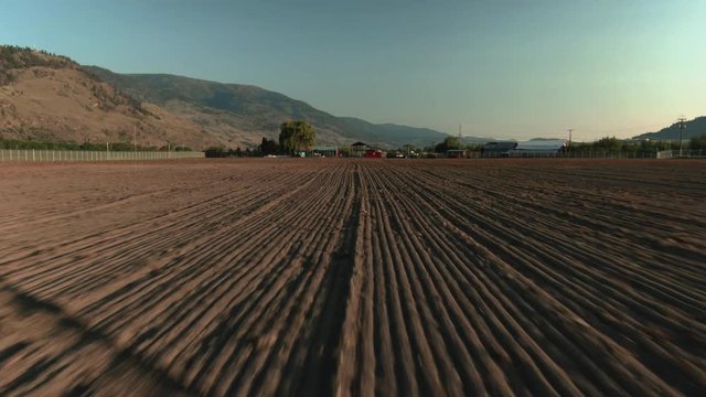 Aerial Drone Shot of Tilled Soil Rows on Farmland, Agriculture. British Columbia Canada