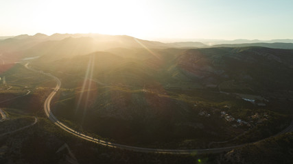 HILS AND ROCKS ON SUNSET  AERIAL VIEW 