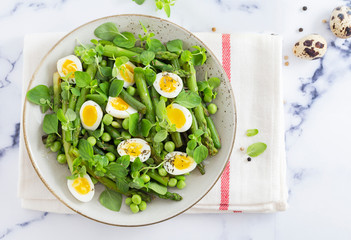 salad with quail eggs and asparagus for summer menu