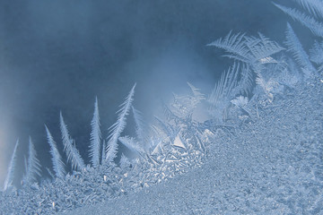 ice patterns on a winter window.. Seasons of nature and uniqueness