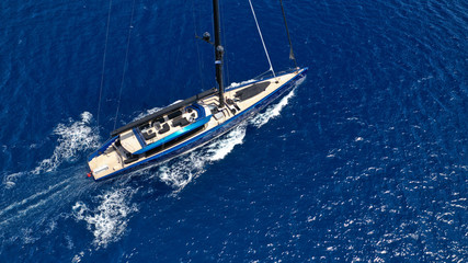 Naklejka premium Aerial photo of beautiful wooden deck sail boat cruising the Aegean blue sea, Greece