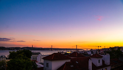 sunset in Lisbon with the bridge and beautiful colours