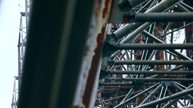 Close-up of large massive metal construction radar system Russian Woodpecker. Amazing view of Duga telecommunication radio center in the courtyard of Chernobyl power plant, Ukraine.