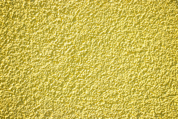 Yellow painted wall concrete stucco surface texture