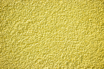Yellow painted wall concrete stucco surface texture