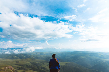 Traveling Woman on mointain over Caucasus landscape enjoying beautiful view Lifestyle success motivation concept adventure active vacations outdoor