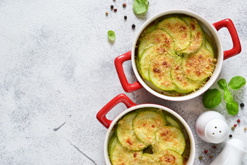 Delicious summer dish with zucchini, cheese and bechamel sauce on an eton background.