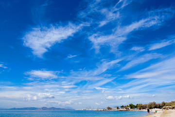 Athens neighborhoods blue beach with golden sand and huge sky