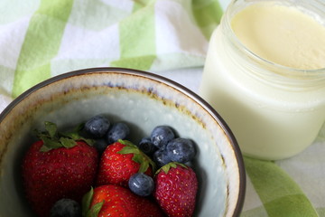 Homemade Yoghurt with Fresh Strawberries and Blueberries on a Wooden Background