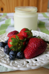 Homemade Yoghurt with Fresh Strawberries and Blueberries on a Wooden Background