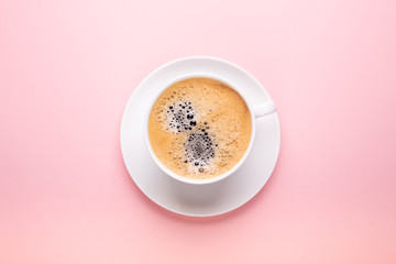 Cup of coffee on black pink background Top view