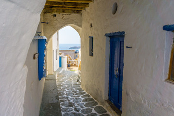 Street view of Chorio with paved alleys and traditional cycladic architecture in Kimolos island in Cyclades, Greece