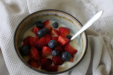 Homemade Yoghurt with Fresh Strawberries and Blueberries on a Wooden Background