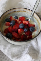 Homemade Yoghurt with Fresh Strawberries and Blueberries on a Wooden Background