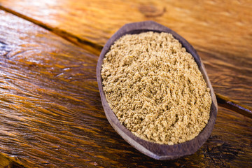 Sweet peanut ground and made in Brazil, called Paçoca, food on rustic wooden table, with space for text, Brazilian sweet. It is present in all the Juninas Festivals. 