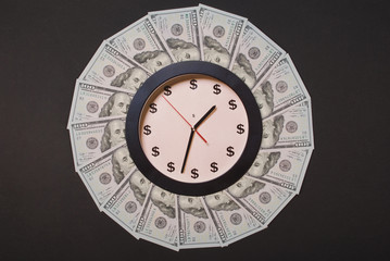 Concept of clock and dollar. Clock on mandala kaleidoscope from money. Abstract money background...