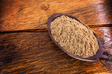 Sweet peanut ground and made in Brazil, called Paçoca, food on rustic wooden table, with space for text, Brazilian sweet. It is present in all the Juninas Festivals. 