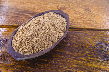 Sweet peanut ground and made in Brazil, called Paçoca, food on rustic wooden table, with space for text, Brazilian sweet. It is present in all the Juninas Festivals. 