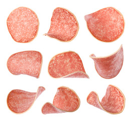 Set of flying cut delicious sausage on white background