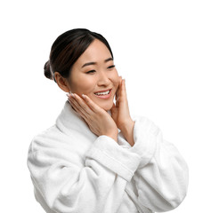 Portrait of beautiful Asian woman in bathrobe isolated on white. Spa treatment