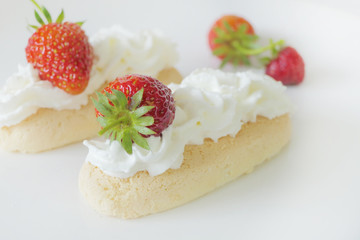 Biscuits with Cream and Strawberries isolated on a White Background