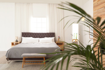 Obraz na płótnie Canvas Modern comfortable bed in room. Interior design