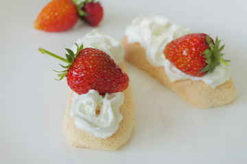 Biscuits with Cream and Strawberries isolated on a White Background