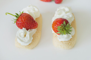 Biscuits with Cream and Strawberries isolated on a White Background