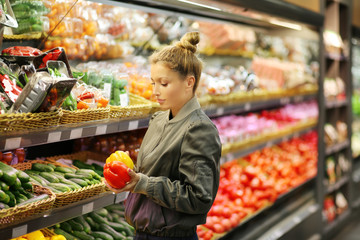 Woman buying vegetables at the market