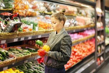 Woman buying vegetables at the market