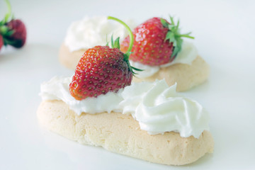 Biscuits with Cream and Strawberries isolated on a White Background